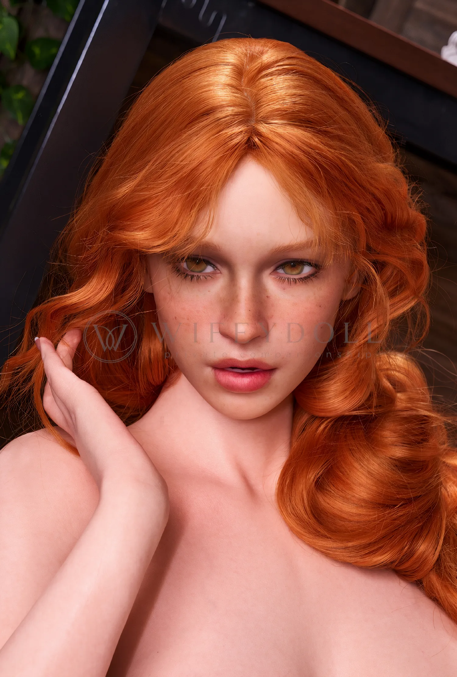 Copper-red waves frame Darcy’s amber eyes and scattered freckles.