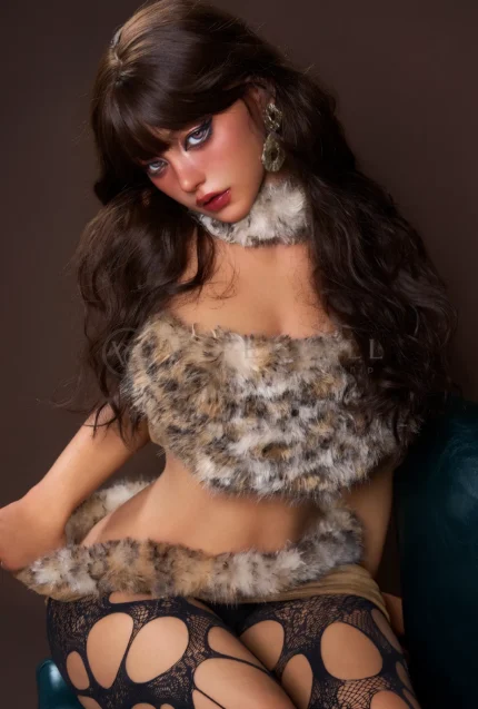 Upper-body portrait of Eileen with blue eyes, long brown hair, and soft fur trim around her neckline.