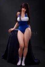 Evie, a 161cm realistic silicone doll, standing in a blue-and-white one-piece swimsuit.