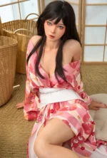 Kagura realistic silicone doll kneeling in a shoji room with a floral kimono draped open.