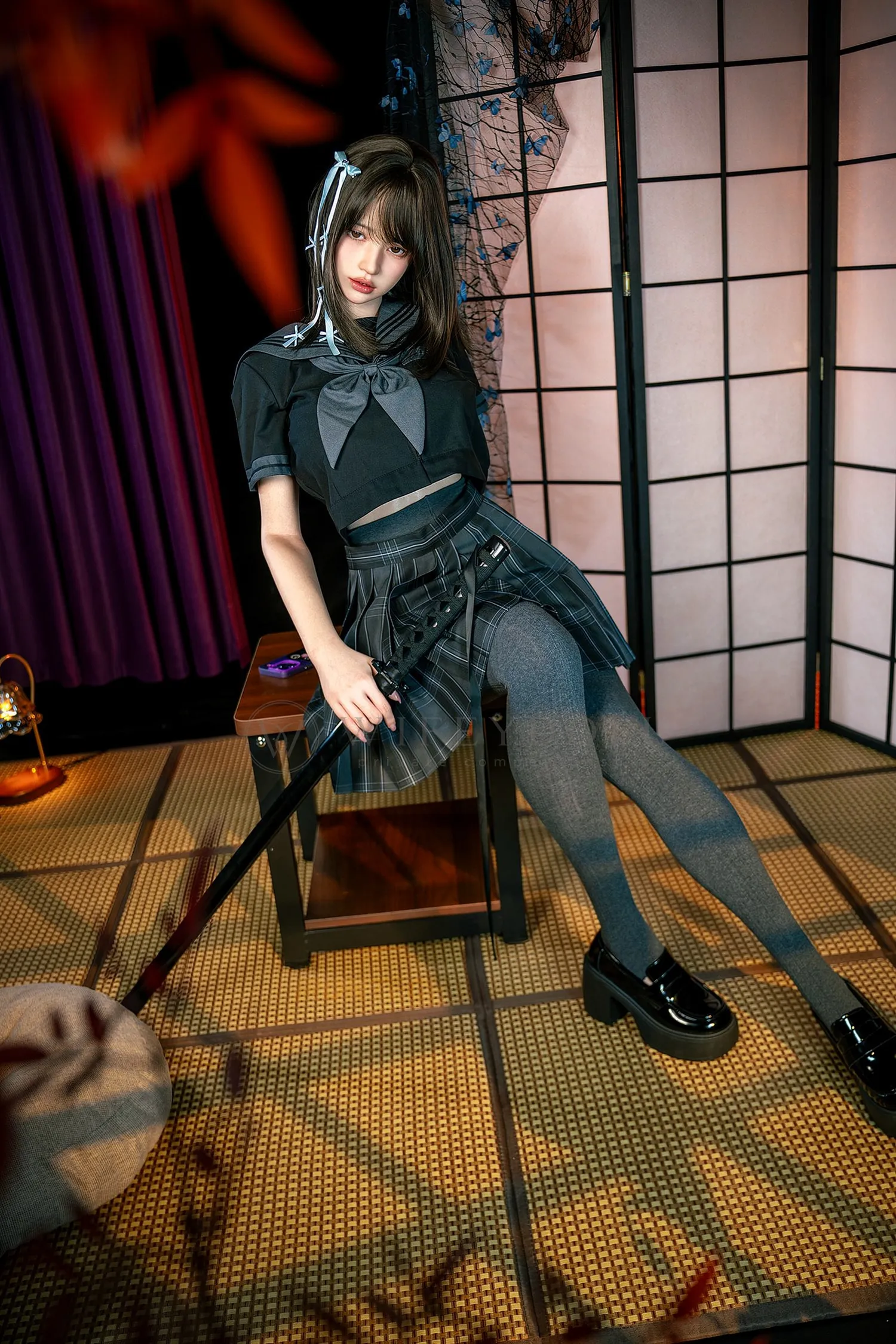 Mika, a 161cm realistic companion doll, seated on a wooden stool with both gray-stockinged legs extended over the tatami floor.