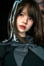 Face close-up of Mika, a 161cm silicone sex doll, with dark bangs, blue hair ribbons, and soft pink lips.
