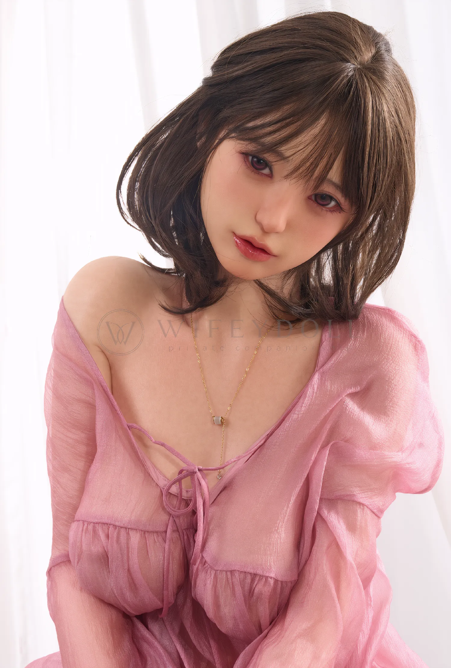 Close portrait of Miku 153cm realistic silicone doll wearing a pink sheer robe.