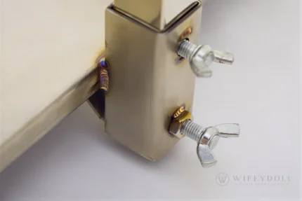 A detailed view of the doll display stand showing the base fasteners for stable support.