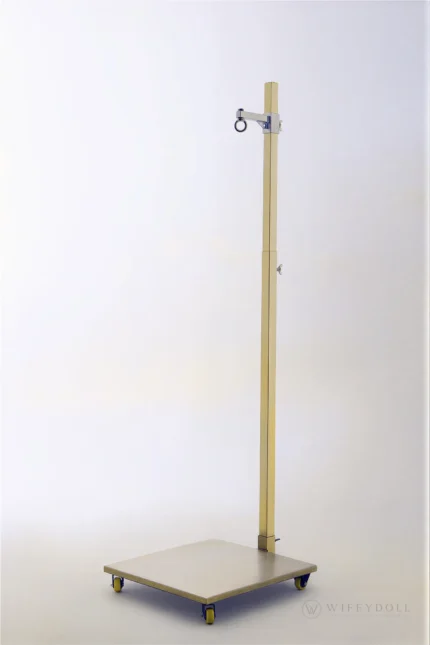 A detailed view of the doll display stand showing the full stand front for stable support.