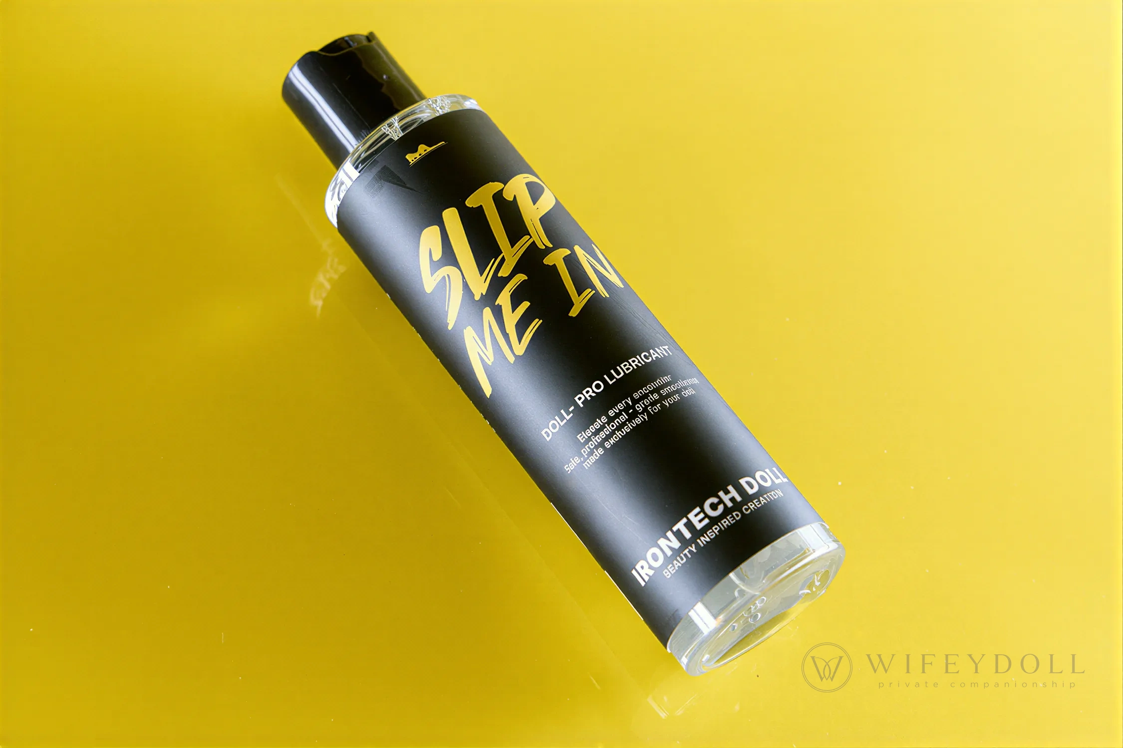 Slip Me In water-based lubricant appears suspended diagonally over a bright yellow surface.