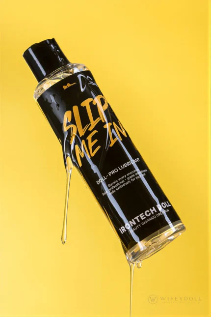 Clear Slip Me In lubricant pours in a smooth stream from a tilted bottle.