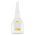 A precision-tip bottle of nail adhesive for attaching replacement nails to silicone doll hands.