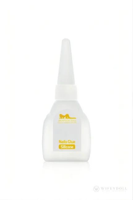 A precision-tip bottle of nail adhesive for attaching replacement nails to silicone doll hands.