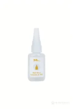 Small precision-tip bottle of nail adhesive for attaching replacement nails to compatible silicone or TPE doll hands.