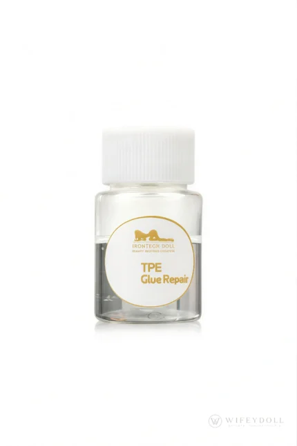 A bottle of repair adhesive labeled for small surface repairs on TPE dolls.