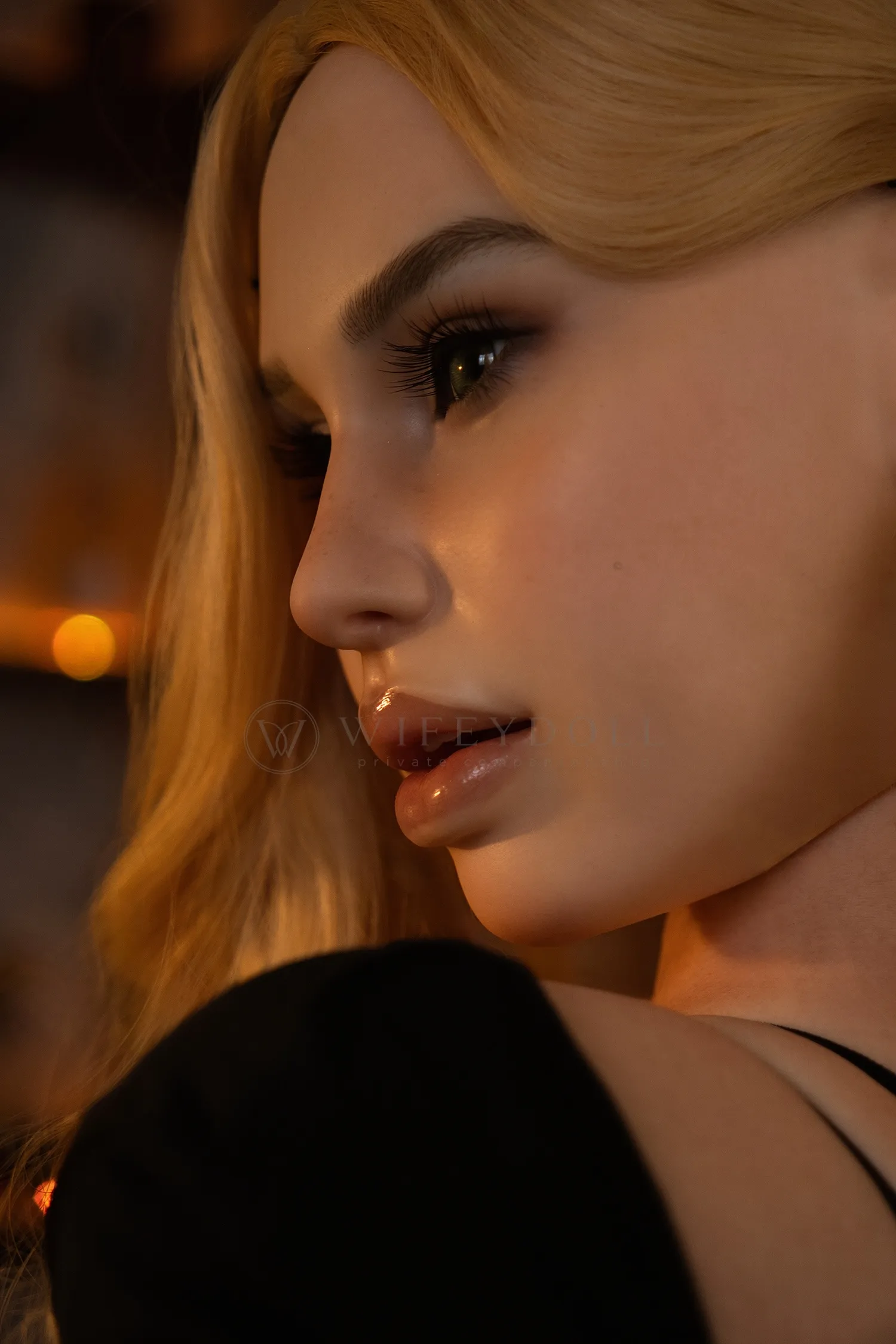 Close-up profile portrait of Pearl under warm bar lighting, showing her blonde hair and dark eye makeup.