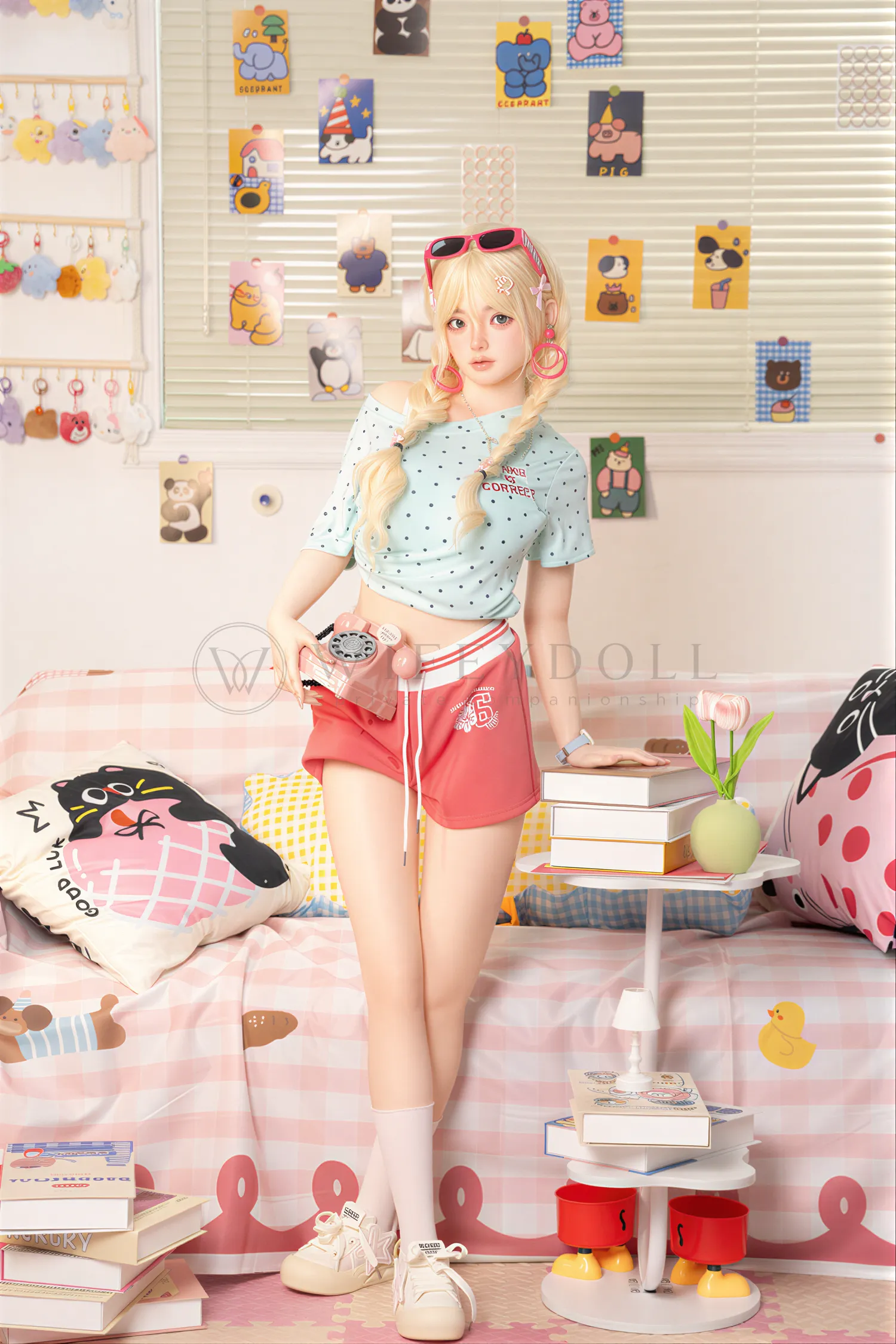 Xia Ying silicone companion doll standing in a pastel room with one hand near her blonde hair.