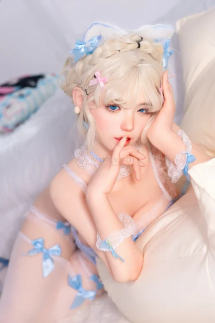 Zia, a 154cm companion doll, rests one hand at her cheek beside the cream cushion in a close portrait.
