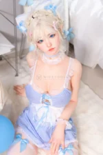 Zia, a 154cm companion doll, sits near the shelf in an upper-body portrait with a lace choker and blue gingham top.