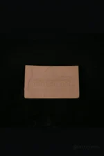 A close-up view of the black silicone test piece for checking skin tone and material finish.