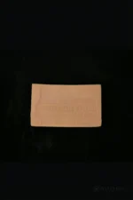 A close-up view of the dark tanned silicone test piece for checking skin tone and material finish.