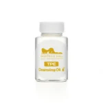 A bottle of cleansing oil labeled for routine care of TPE doll surfaces.
