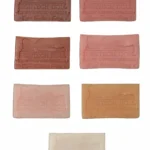 Comparison of TPE material samples in multiple skin tones for custom doll color selection.