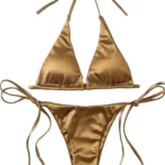 Flat lay of a gold bikini for doll styling.