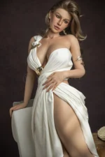 Nina realistic silicone sex doll tilting her head toward a raised shoulder, a gold cuff beside her white dress.